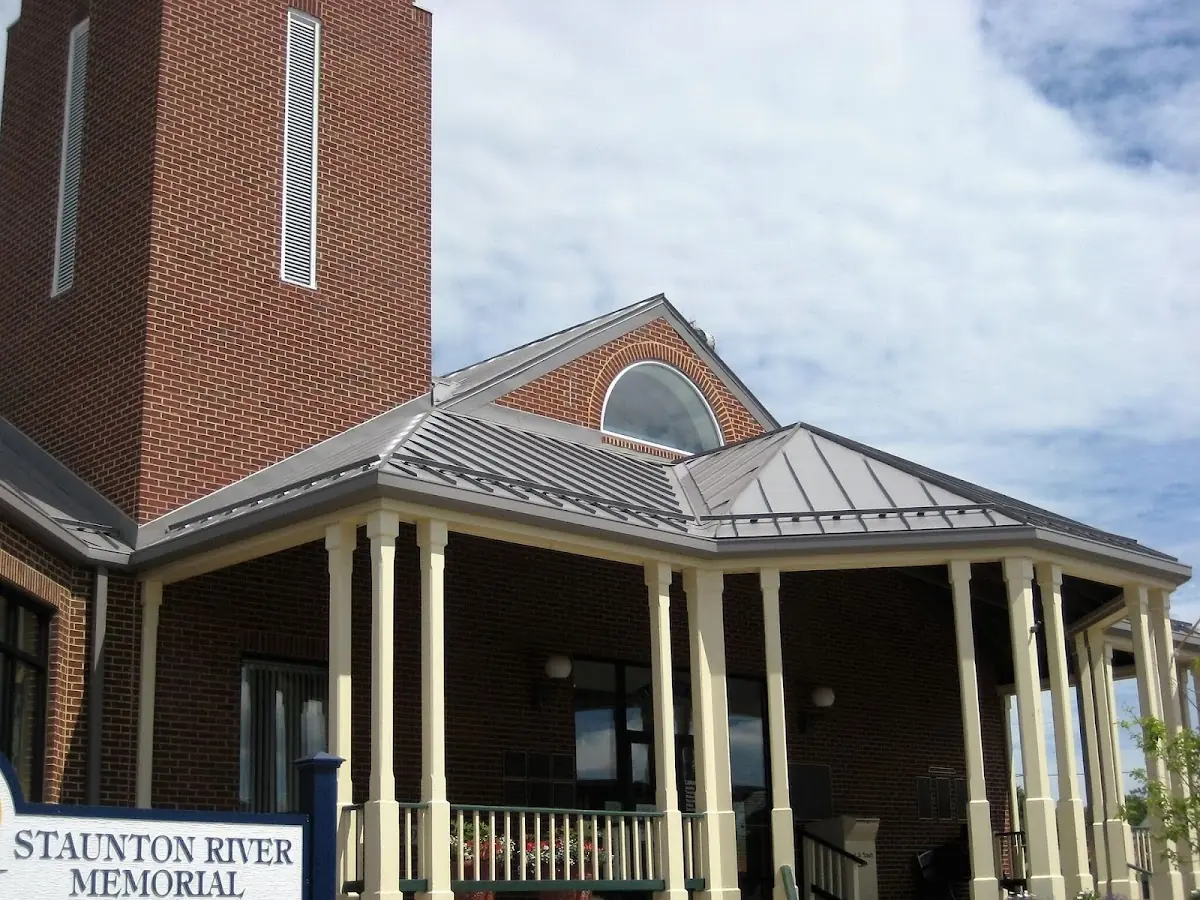 Skilled roofing craftsmen working on a residential roof in Downtown Melrose